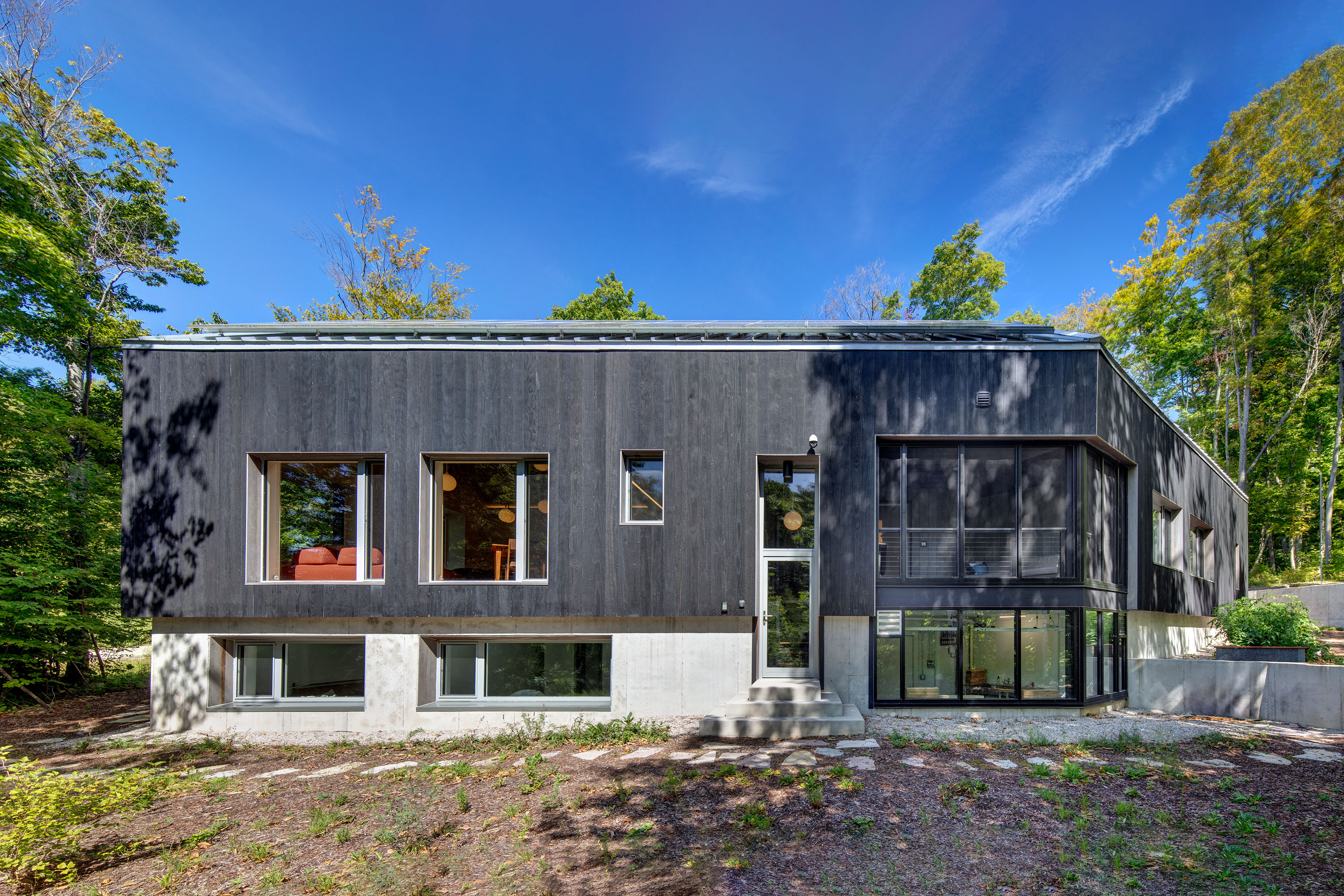 The side of the home, which shows off the enclosed but unconditioned porch.